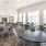 Large dinging lounge with many tables and chairs