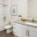 Model bathroom at our 55 and over community in Myrtle Beach, SC, featuring wood grain flooring and a shower / bath combo.