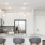 Model kitchen at The Grove at Coastal Grand apartments in Myrtle Beach, SC, featuring countertop seating.