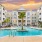 Resort-style swimming pool with lounge seating