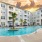 Resort-style swimming pool with lounge seating